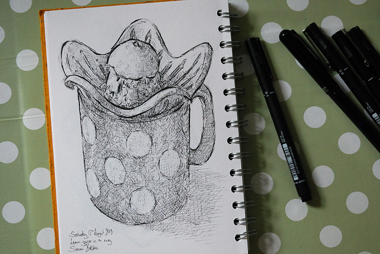 Drawing of a lemon juicer in a mug