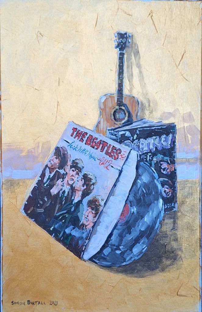 Still life of Beatles objects and guitar